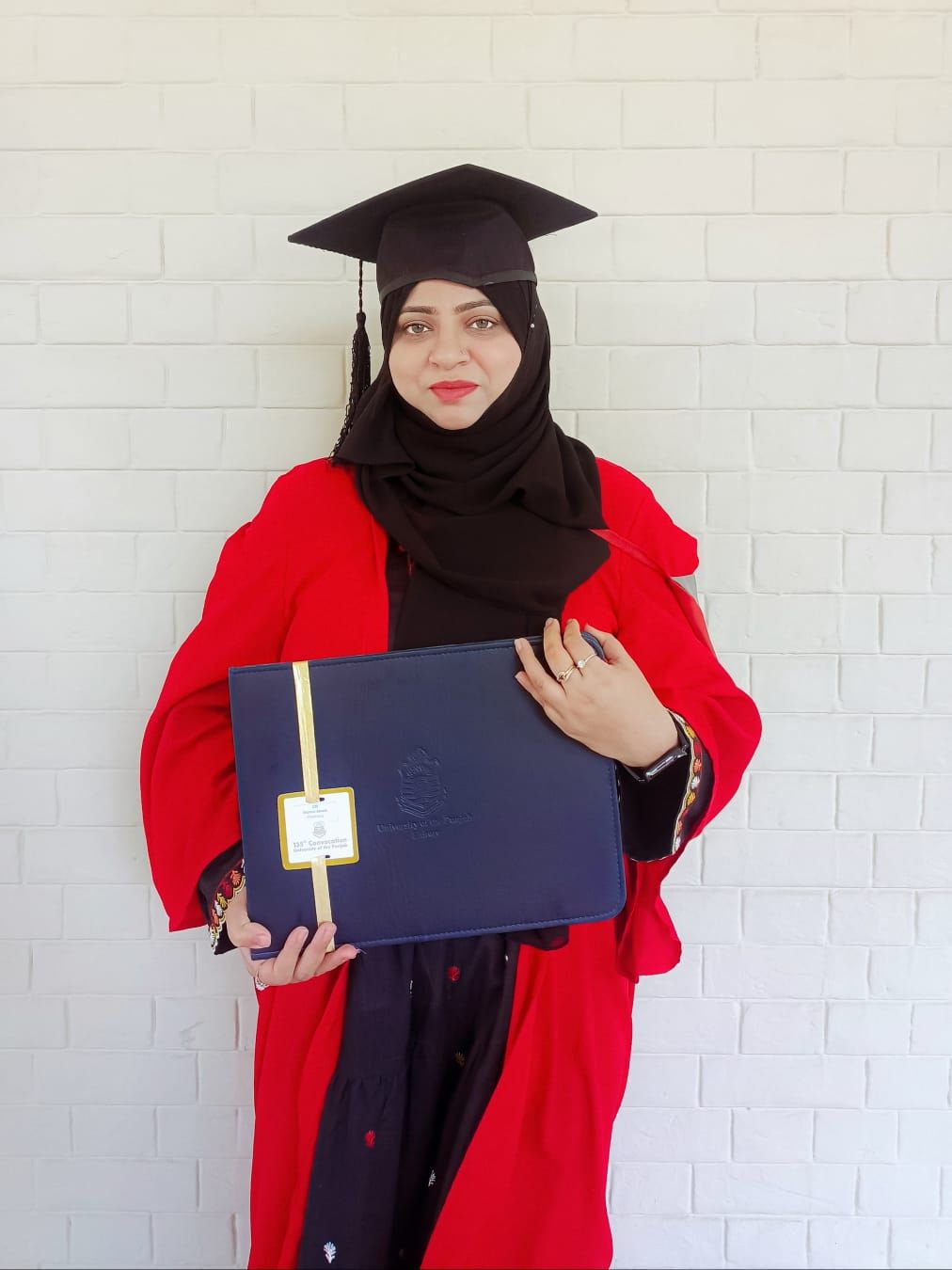 Dr. Momal Akram in academic dress at the 135th Convocation, University of the Punjab